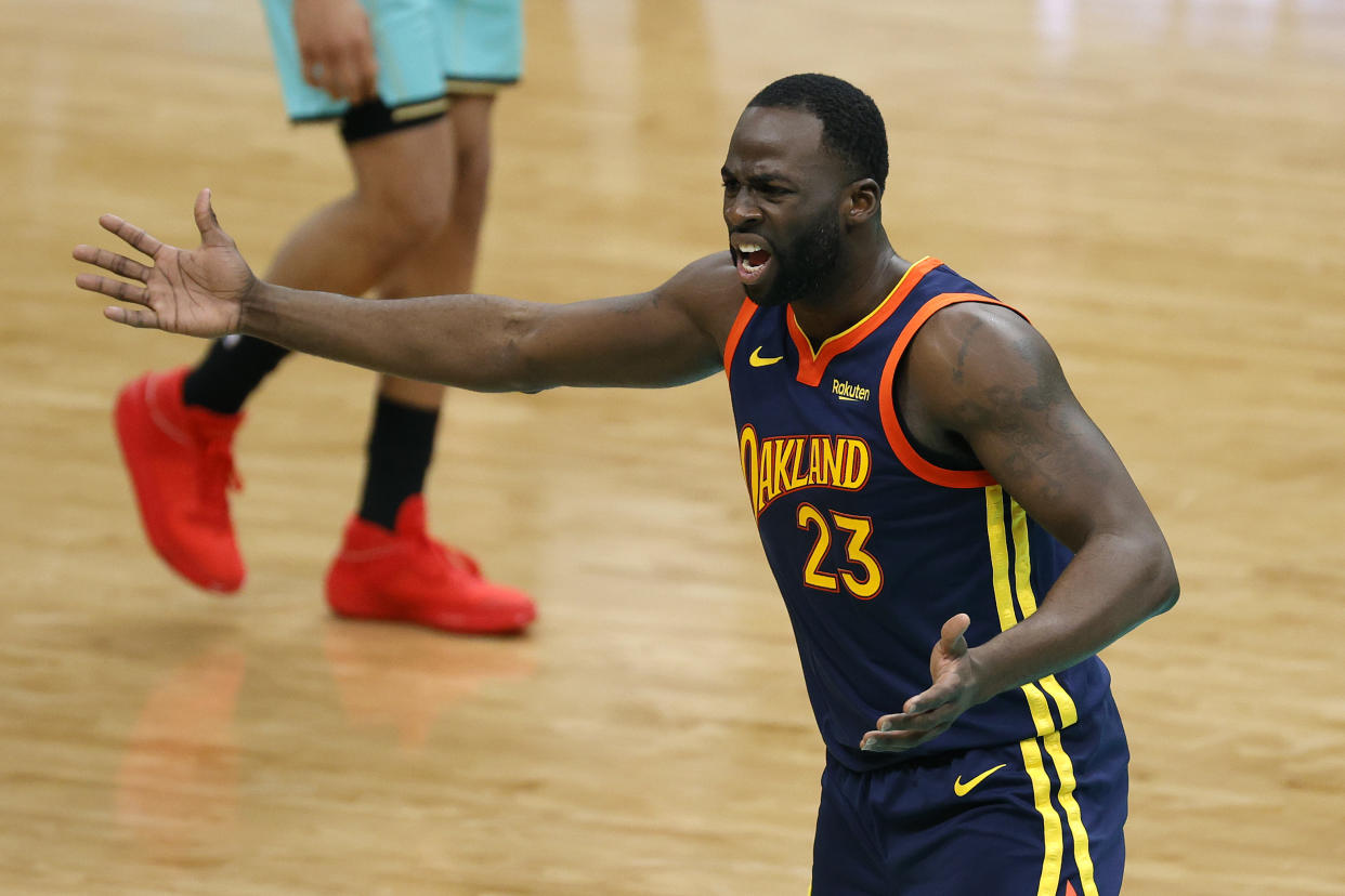 CHARLOTTE, NORTH CAROLINA - FEBRUARY 20: Draymond Green #23 of the Golden State Warriors reacts following a call during the fourth quarter of their game against the Charlotte Hornets at Spectrum Center on February 20, 2021 in Charlotte, North Carolina. NOTE TO USER: User expressly acknowledges and agrees that, by downloading and or using this photograph, User is consenting to the terms and conditions of the Getty Images License Agreement. (Photo by Jared C. Tilton/Getty Images)