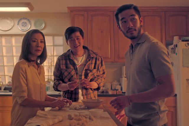 <p>Courtesy of Netflix</p> Michelle Yeoh as Mama Sun, Sam Song Li as Bruce Sun, Justin Chien as Charles Sun in "The Brothers Sun"