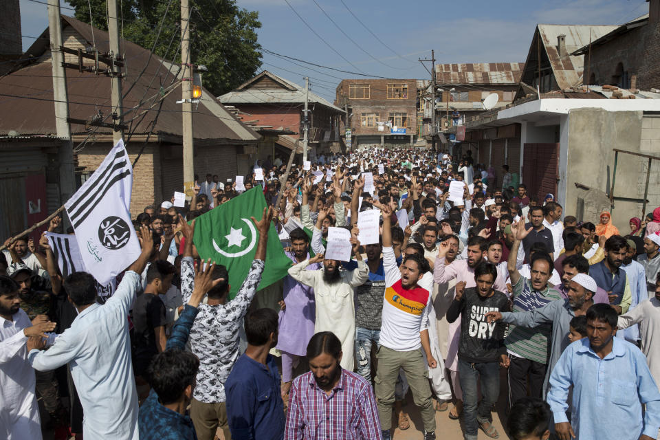 FILE - In this Monday, Aug. 12, 2019 file photo, Kashmiri Muslims shout "We want freedom" and "Go India, Go back," during a protest after Eid prayers during a security lockdown in Srinagar, Indian controlled Kashmir. Gulf Arab countries have remained mostly silent as India’s government moved to strip the Indian-administered sector of Kashmir of its limited autonomy, imposing a sweeping military curfew in the disputed Muslim-majority region and cutting off residents from all communication and the internet. (AP Photo/ Dar Yasin, File)