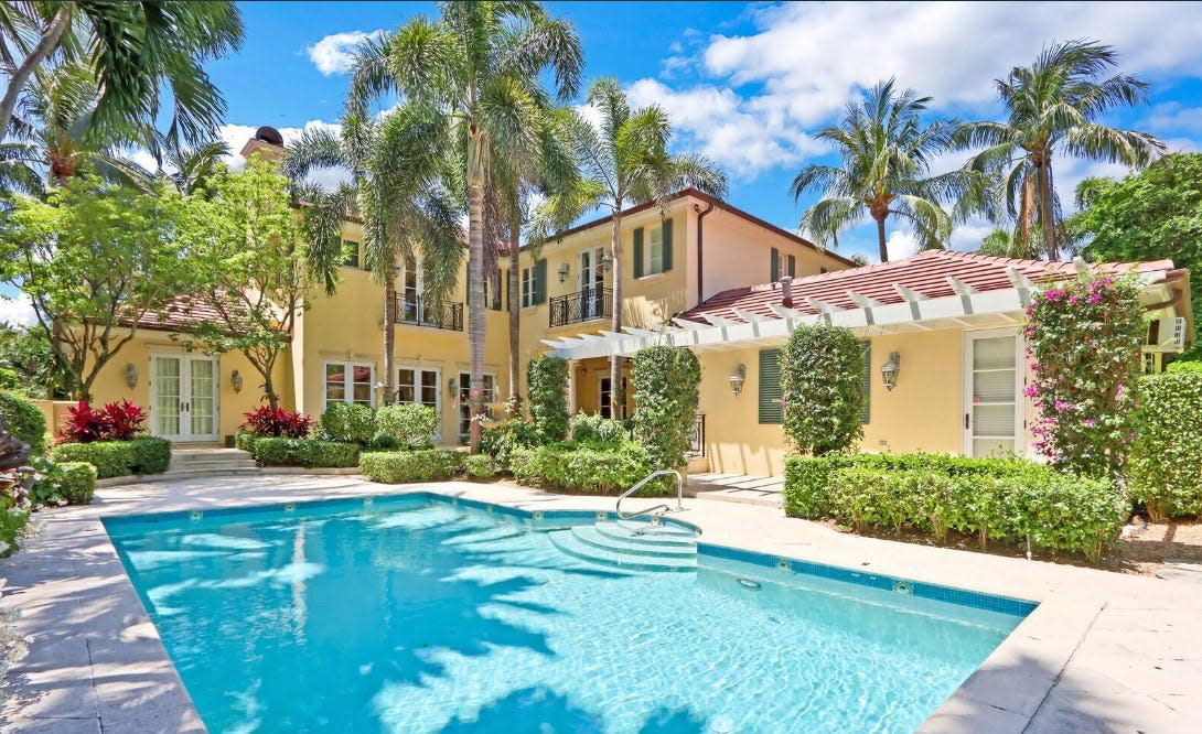 The wings of a Palm Beach house listed for $16.995 million wrap around the pool area at 223 Coral Lane.