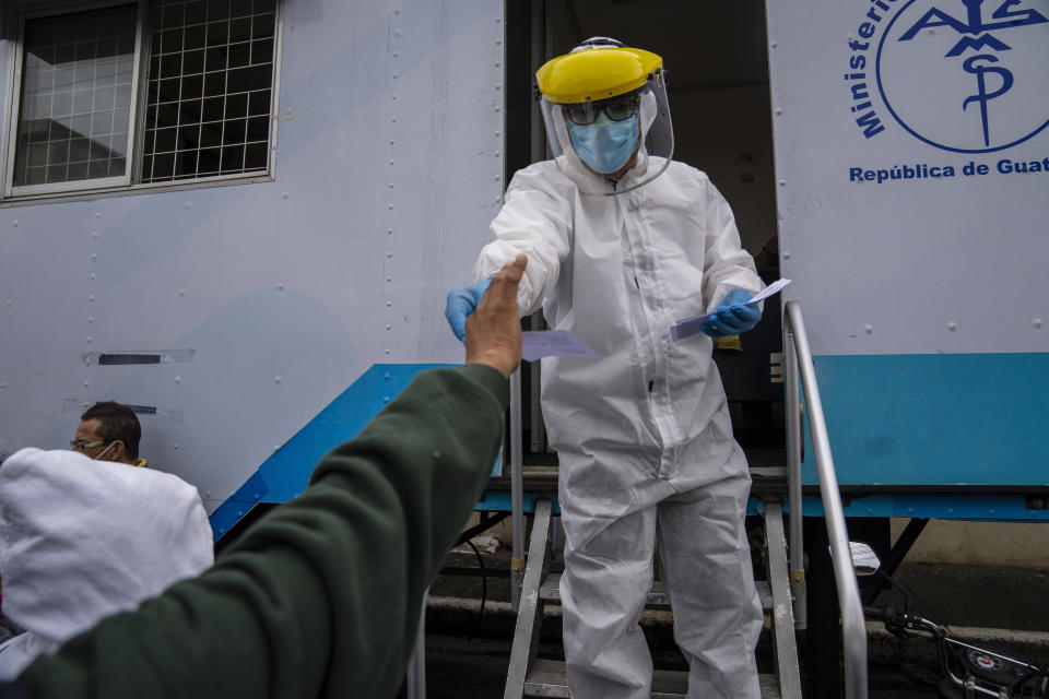 A man receives his results after getting a free COVID-19 test at a Health Ministry facility in Guatemala City, Wednesday, Aug. 25, 2021 (AP Photo/Moises Castillo)