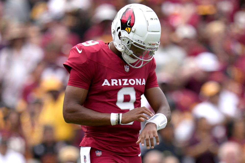 Joshua Dobbs (9) of the Arizona Cardinals looks at his play card during the first half against the Washington Commanders at FedExField on Sept. 10, 2023, in Landover, Maryland.