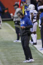 Indianapolis Colts coach Frank Reich looks at his play chart during the second half of the team's NFL football game against the Chicago Bears, Sunday, Oct. 4, 2020, in Chicago. (AP Photo/Charles Rex Arbogast)