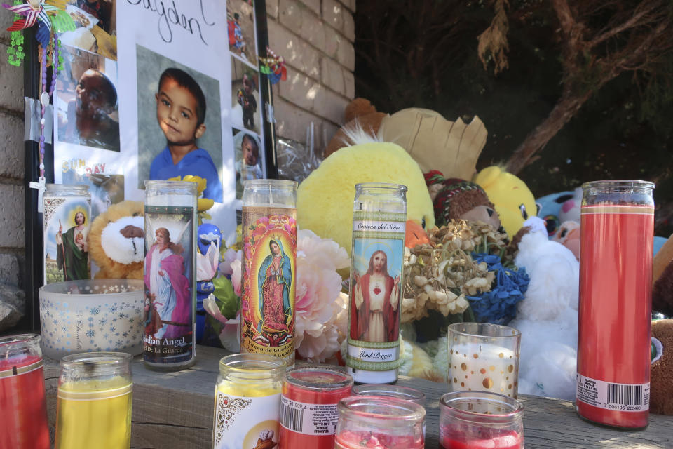 A memorial for a 6-year-old boy in Flagstaff, Arizona, grows on Wednesday, March 4, 2020, as residents add stuffed animals, balloons, candles and messages for the child. Police have arrested the boy's parents and grandmother on suspicion of murder and child abuse in the boy's death. (AP Photo/Felicia Fonseca)