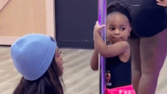 A mother and her daughter attend a pole fitness class at Pink Poles Studio in Atlanta, Georgia.