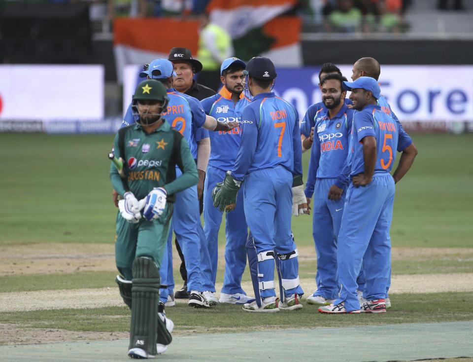 India's Kedar Jadhav, third right, celebrates with teammates the dismissal of a Pakistan batsman during the one day international cricket match of Asia Cup between India and Pakistan in Dubai, United Arab Emirates, Wednesday, Sept. 19, 2018. (AP Photo/Aijaz Rahi)