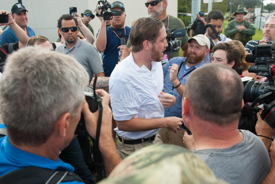 A man leaving the Richard Spencer event is accosted by people waiting outside.