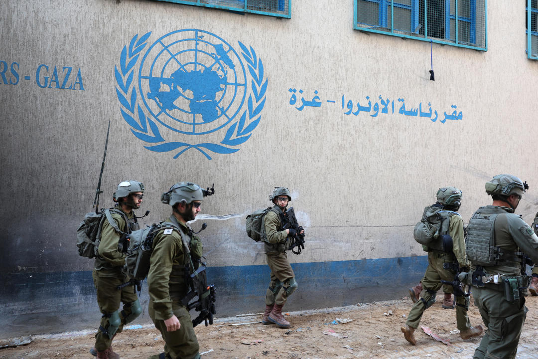 --PHOTO TAKEN DURING A CONTROLLED TOUR AND SUBSEQUENTLY EDITED UNDER THE SUPERVISION OF THE ISRAELI MILITARY-- This picture taken during a media tour organised by the Israeli army on February 8, 2024, shows Israeli soldiers inside an evacuated compound of the United Nations Relief and Works Agency for Palestine Refugees (UNRWA) in Gaza City, amid ongoing fighting between Israel and the Palestinian militant group Hamas. (Photo by JACK GUEZ / AFP) (Photo by JACK GUEZ/AFP via Getty Images)