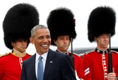 U.S. President Barack Obama smiles as he walks past an honor guard upon arrival to attend the North American Leaders' Summit in Ottawa, Canada June 29, 2016. REUTERS/Kevin Lamarque