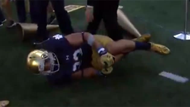 Tranquill clutches at his knee in agony. Image: YouTube