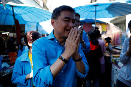 FILE PHOTO: Democrat Party leader and former Thailand's Prime Minister Abhisit Vejjajiva greets people during his campaign rally in Bangkok, Thailand January 29, 2019. REUTERS/Soe Zeya Tun/File photo