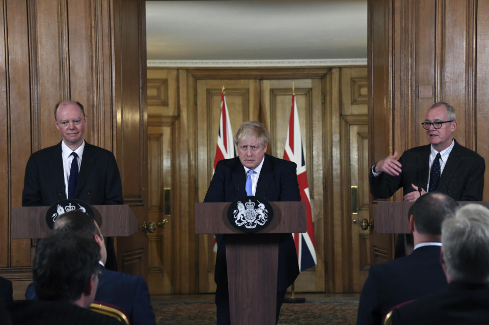 From left, Chief Medical Officer for England Chris Witty, Britain's Prime Minister Boris Johnson and Chief Scientific Adviser Patrick Vallance speak during a press conference about coronavirus in 10 Downing Street in London, Monday, March 9, 2020. (AP Photo/Alberto Pezzali) (Photo: ASSOCIATED PRESS)