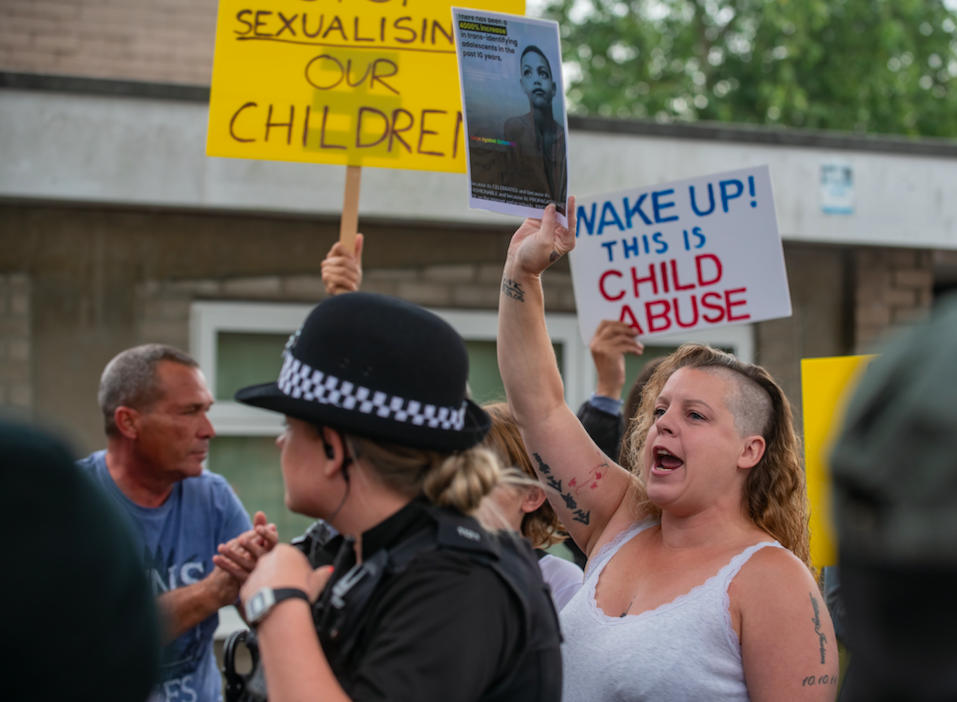 Protestors and supporters clashed outside a scheduled book reading by drag queen Aida H Dee. (SWNS)