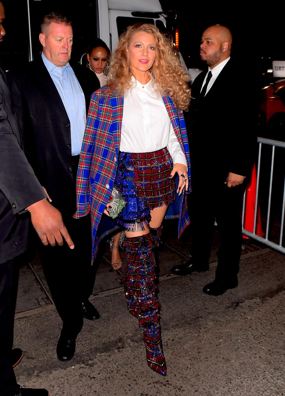 <p>The fashion didn’t stop at the Metropolitan Museum for Blake Lively on Monday night. She continued her fashion reign as one of the night’s best dressed as she changed out of her stunning Versace gown into a tartan ensemble with a mini skirt, matching knee high boots, and a blue jacket draped over her shoulders. (Photo: Splash News) </p>
