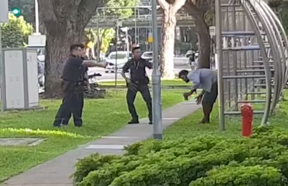 Singapore police tasering a drunk man who had attempted to assault an officer. The man was charged on Wednesday (12 June). (PHOTO: Screenshot/Roads SG Facebook page)