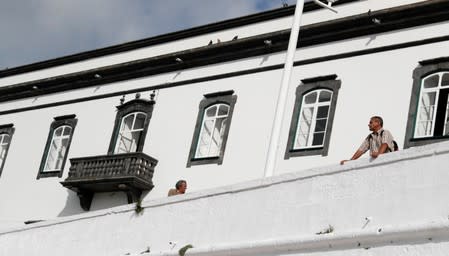 A man looks at the sea in Angra do Heroismo in the Azores islands