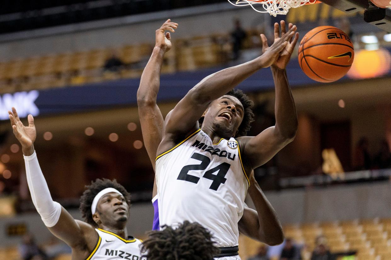 Missouri's Kobe Brown, right, contends for a rebound during the first half against Paul Quinn College on Monday at Mizzou Arena.