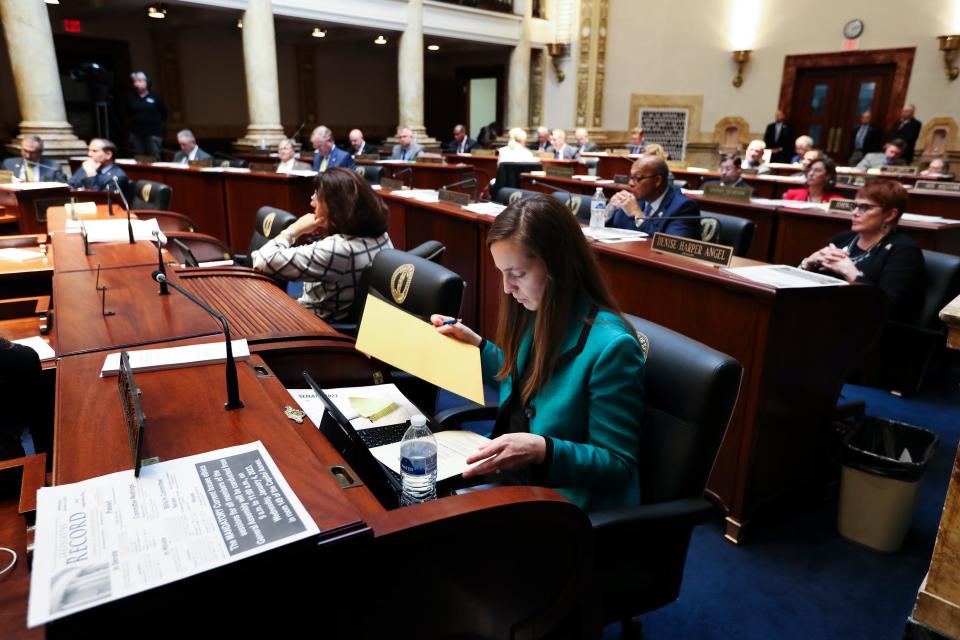 State Sen. Adrienne Southworth (R-Lawrenceburg) looked at documents during a session of the Kentucky State Senate in the senate chamber inside the State Capitol in Frankfort, Ky. on Jan. 4, 2023.  Southworth’s desk was reassigned to the far corner of the Democratic section of the chamber.
