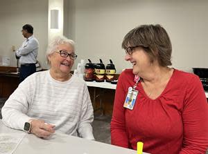 Volunteers and participants in Meritus Health's Care Callers program meet for lunch.