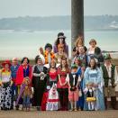 <div class="caption-credit"> Photo by: SWNS</div>The guests got into the spirit by wearing fairy tale costumes. "I was standing at the altar, there were only three guests in the room and they were dressed up. As the lift opened these people started to sit down but there was one dressed as a Flintstone with big feet," says Paul. "I started jumping up and down with laughter, if it wasn't for my friends and their embracing it, it wouldn't have been as special as it was."