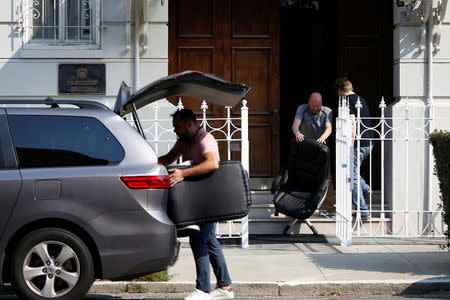 Members of the Consulate General of Russia load furniture into a vehicle in San Francisco, California, U.S. September 2, 2017. REUTERS/Stephen Lam