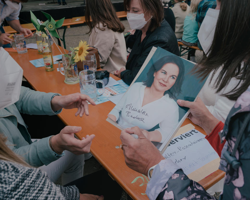 Baerbock hands her autograph to a supporter at the beer garden as part of a campaign event in Dachau<span class="copyright">Ingmar Björn Nolting for TIME</span>