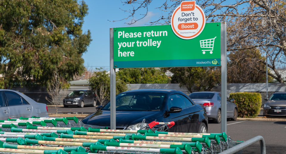 A shopping trolley collection bay in a Woolworths car park. 