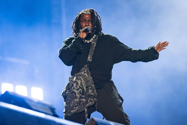 <p>Jason Koerner/Getty</p> Kendrick Lamar performs in Miami in July 2022