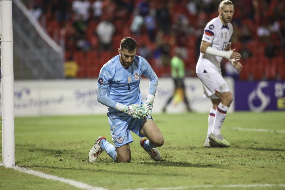 United States' goalkeeper Matthew Turner, center, reacts after catching a goal from Trinidad and Tobago's Albin Jones, during a CONCACAF Nations League quarterfinal soccer match at Hasely Crawford Stadium in Port of Spain, Trinidad and Tobago, Monday, Nov. 20, 2023. (AP Photo/Azlan Mohammed)