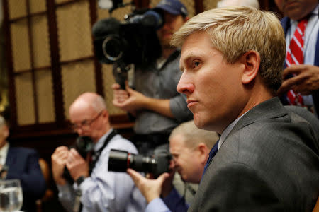 ‪Vice President Mike Pence's chief of staff, Nick Ayers listens during a working lunch with U.S. President Donald Trump, the Vice President and governors in the Roosevelt Room at the White House in Washington, U.S., June 21, 2018. REUTERS/Leah Millis