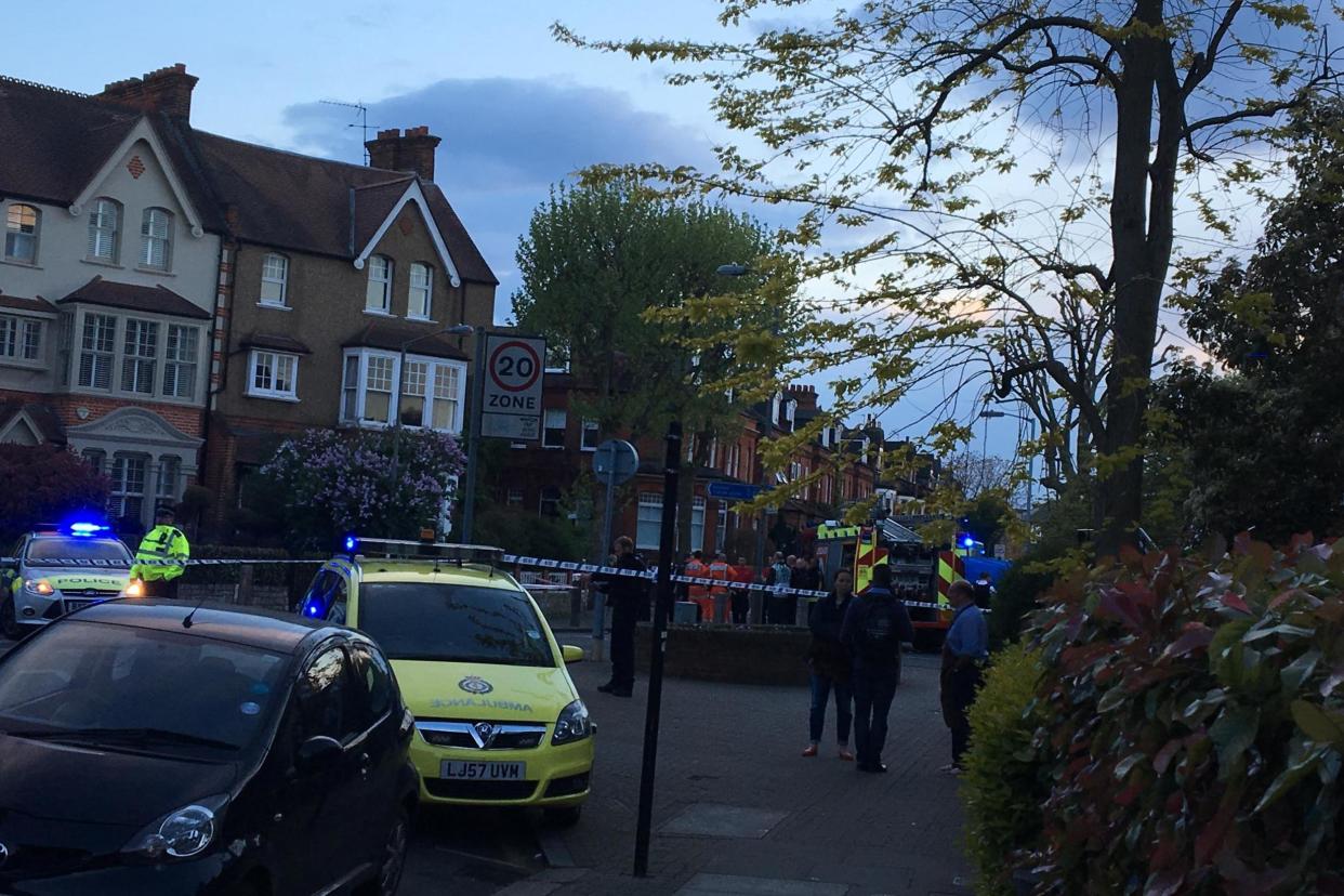 Emergency services: Police and ambulance crews at the scene in Wandsworth