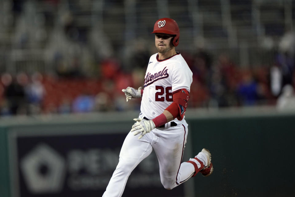 Washington Nationals' Lane Thomas (28) runs to third on his triple during the seventh inning of a baseball game against the Chicago Cubs in Washington, Wednesday, May 3, 2023. (AP Photo/Manuel Balce Ceneta)