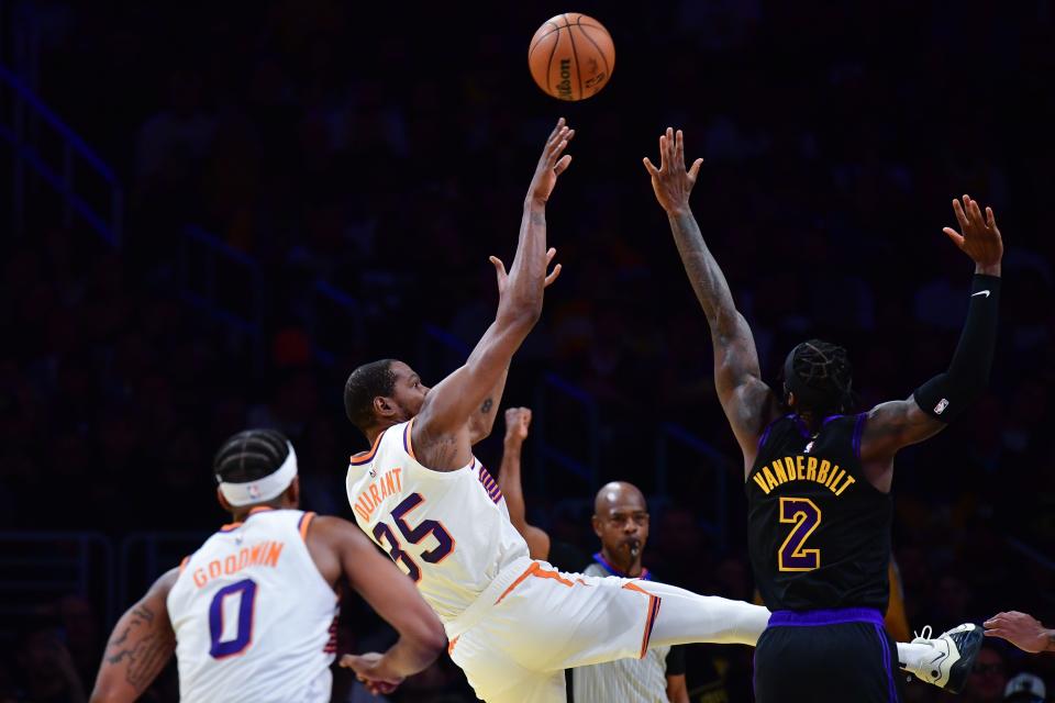 Phoenix Suns forward Kevin Durant (35) shoots against Los Angeles Lakers forward Jarred Vanderbilt (2) during the first half of the In-Season Tournament quarterfinal at Crypto.com Arena in Los Angeles on Dec. 5, 2023.