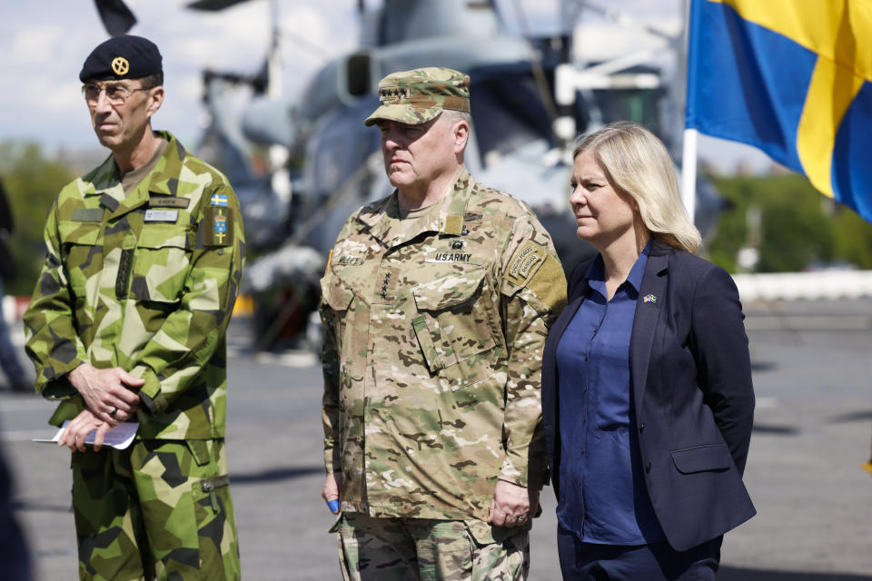 From left, Swedish Armed Forces Commander-in-Chief Micael Bydén, Army Gen. Mark Milley, chairman of the Joint Chiefs of Staff, and Swedish Prime Minister Magdalena Andersson aboard the American amphibious warship USS Kearsarge in Stockholm, Saturday, June 4, 2022. (Fredrik Persson/TT News Agency via AP)