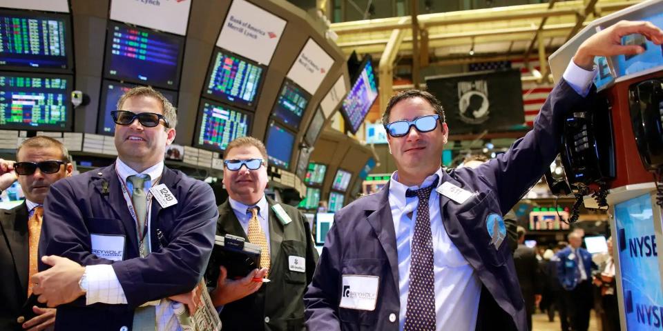 people wearing sunglasses on stock nyse floor