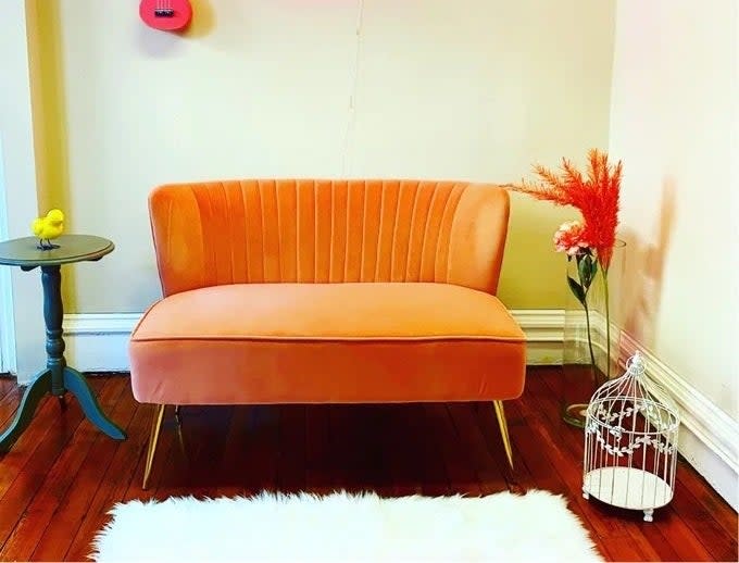 orange couch in a room