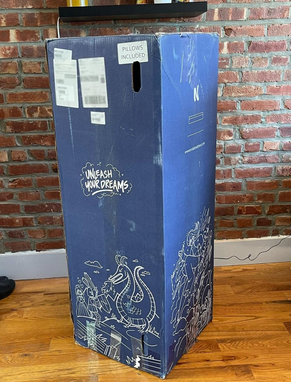 a blue mattress box with white text on it