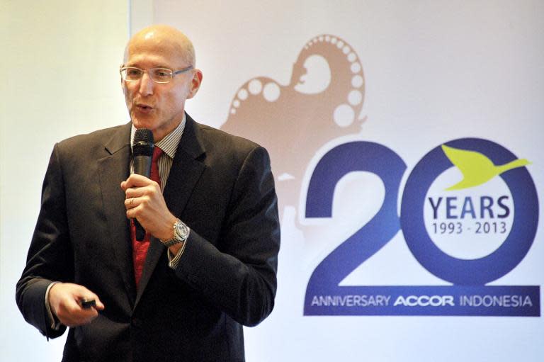 Michael Issenberg, chief operating officer for Accor Asia-Pacific, briefs journalists during a press conference in Jakarta on December 11, 2013 about the company's record-breaking growth in two decades as a hotel operator in Indonesia