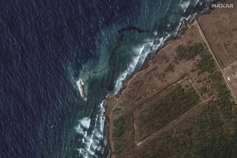 This satellite image provided by Maxar Technologies shows an oil spill caused by an overturned vessel off the coast of Tobago near Scarborough, Trinidad and Tobago, Wednesday, Feb. 14, 2024. (Maxar Technologies via AP)