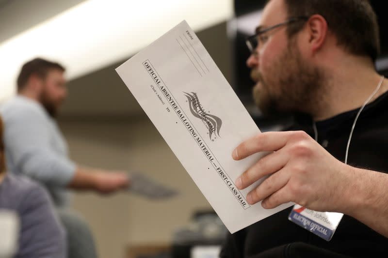 Absentee ballots are counted during the presidential primary election in Wisconsin