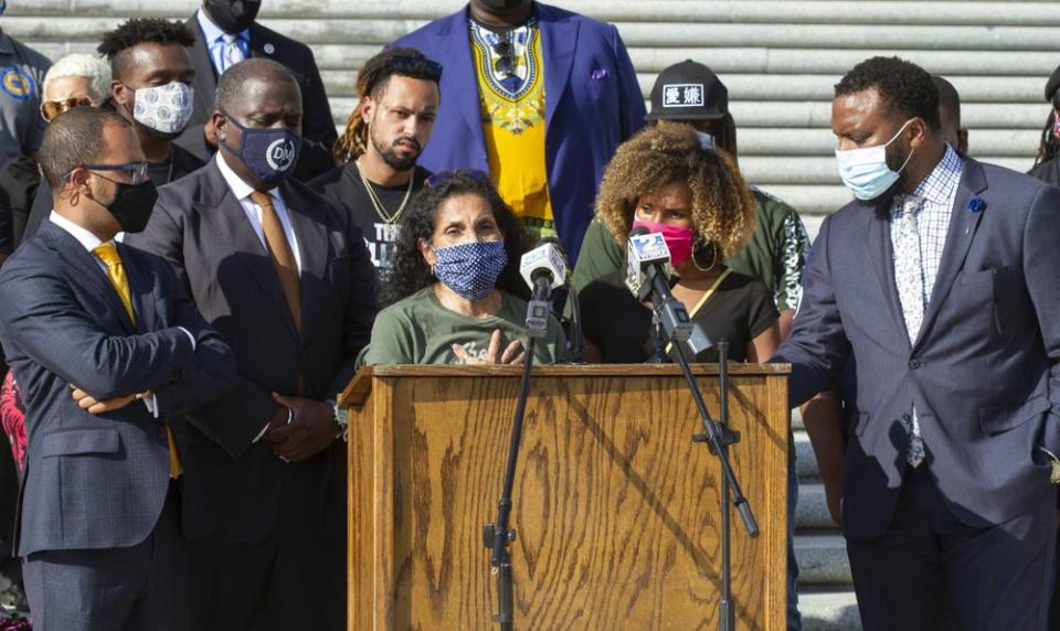 Mona Hardin, center left at podium, mother of Ronald Greene, speaks at a news conference outside the Louisiana State Capitol in Baton Rouge on Oct. 7, 2020. (AP Photo/Dorthy Ray)