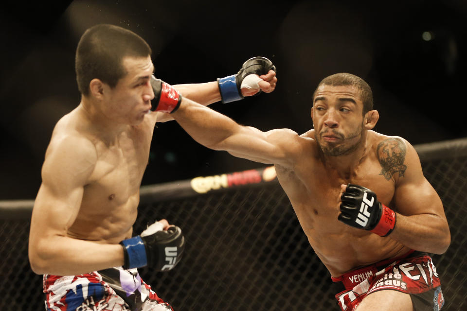 FILE - In this Aug. 4, 2013, file photo, Jose Aldo, from Brazil, right, and Chan Sung Jung, from South Korea, battle during their mixed martial arts Featherweight Championship bout in Rio de Janeiro, Brazil. Alexander Volkanovski will defend his featherweight title in the main event at UFC 273 on Saturday night, April 9, 2022, at Veterans Memorial Arena in Jacksonville when he takes on Chan Sung Jung, better known as “The Korean Zombie." (AP Photo/Felipe Dana,File)
