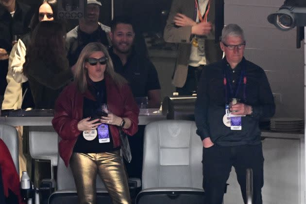 Apple CEO Tim Cook watching the game from a VIP box.