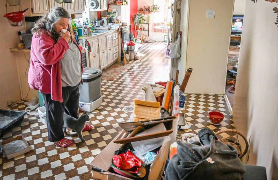 Terri Nishimura stands in her kitchen while packing up belongings to move out of the El Portal Trailer Park near Yosemite National Park on Sunday, March 13, 2022.