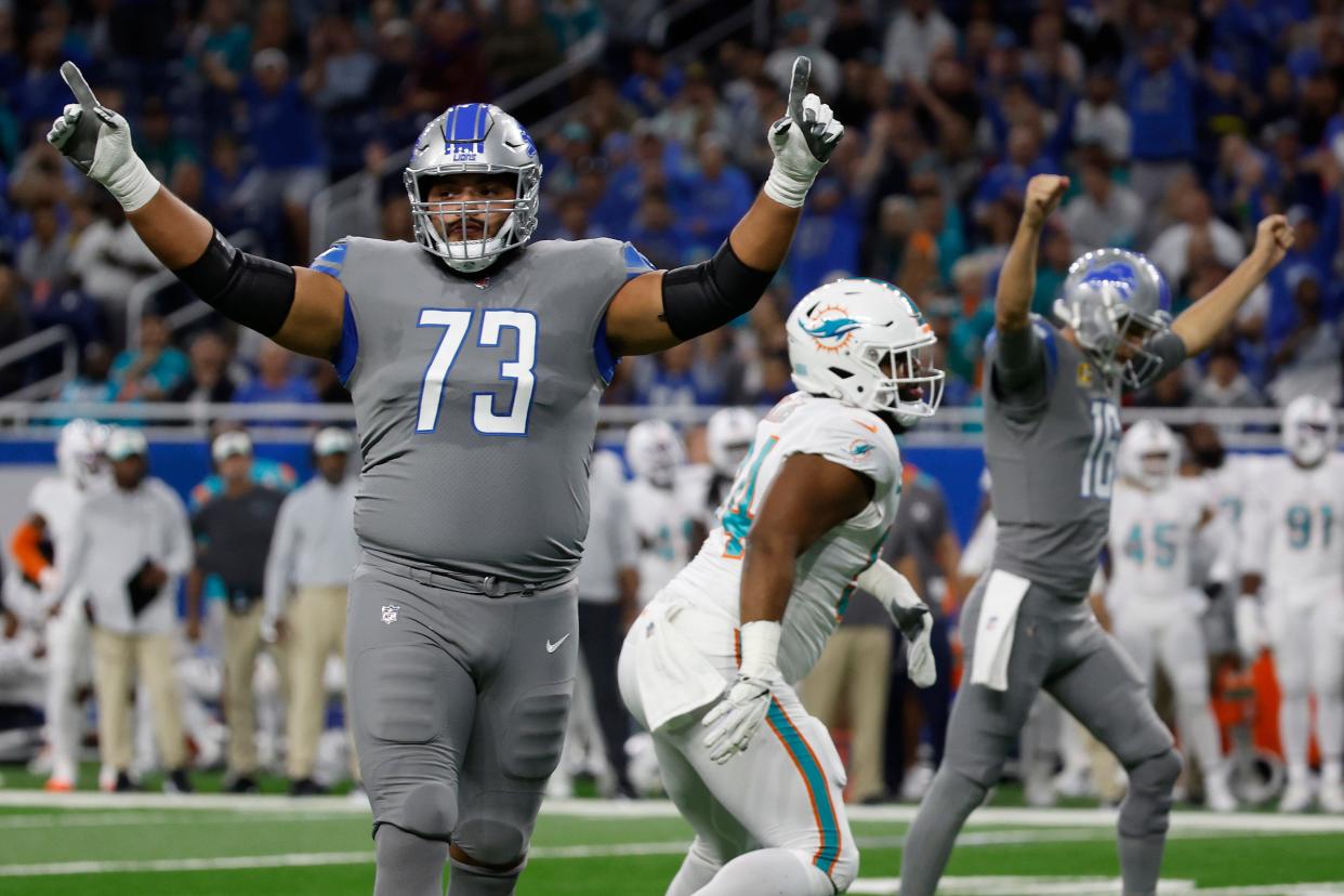 DETROIT, MICHIGAN - OCTOBER 30: Jonah Jackson #73 of the Detroit Lions celebrates a touchdown against the Miami Dolphins during the first quarter at Ford Field on October 30, 2022 in Detroit, Michigan. (Photo by Leon Halip/Getty Images)