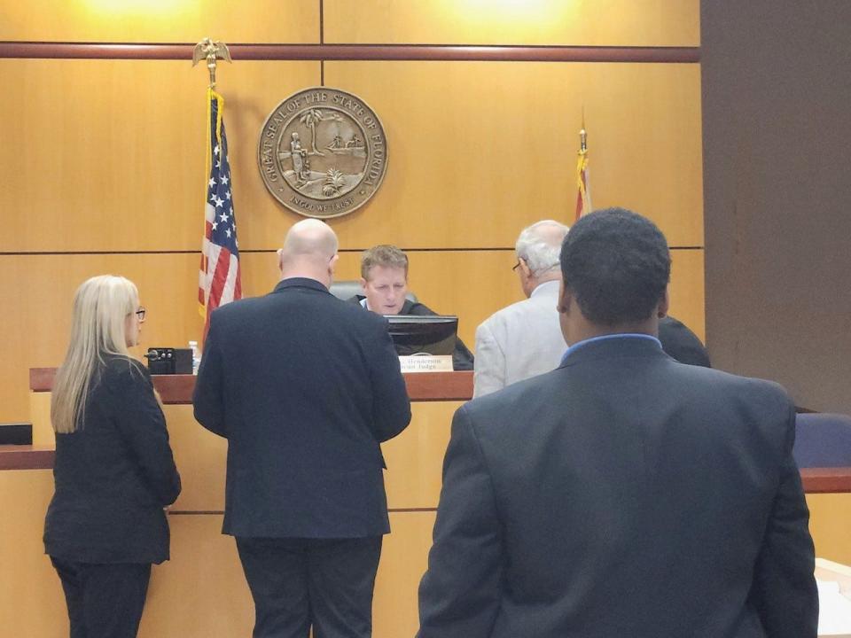 Facing Brevard Circuit Judge Steve Henderson and standing behind attorneys, Jamarcus Simpson is pictured during a plea hearing Wednesday. He and Juan Shuren were both charged with first degree murder in the December 2022 shooting deaths of two Palm Bay teens.