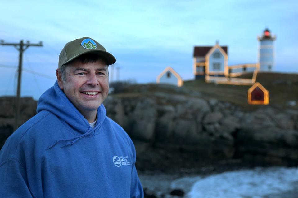 Nubble Lighthouse keeper Matt Rosenberg speaks about what goes into lighting the lighthouse for Christmas each year on Monday, Dec. 5, 2022, in York.