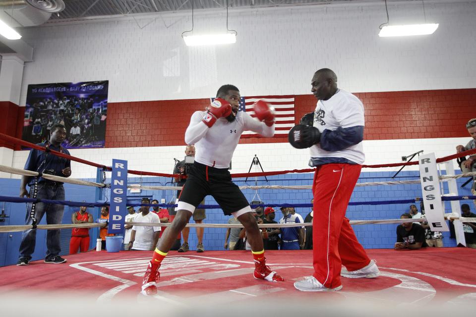Boxing world champion Adrien Broner (left) trains with Mike at Cincinnati Golden Gloves in 2014.