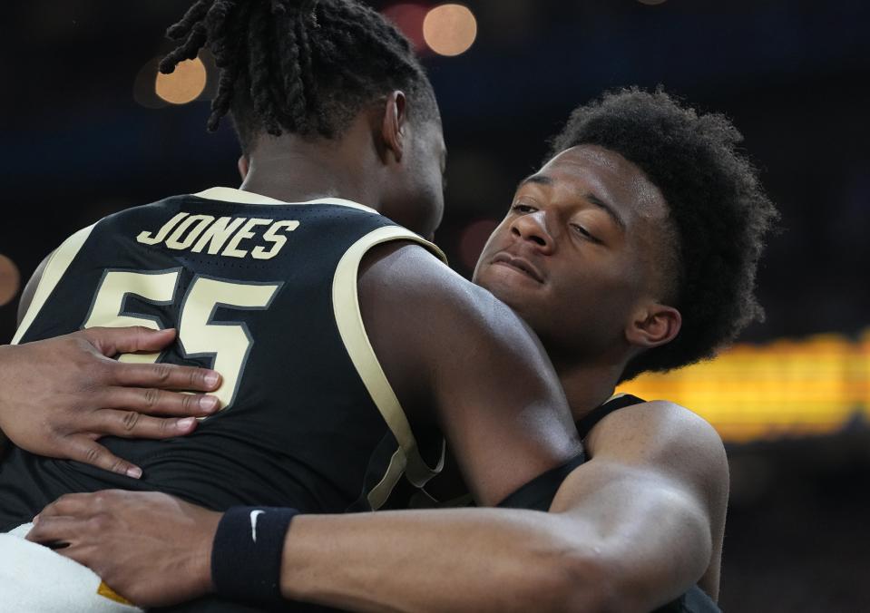 Purdue Boilermakers guard Lance Jones (55) and Purdue Boilermakers guard Myles Colvin (5) hug after the NCAA Men’s Basketball Tournament Championship, Monday, April 8, 2024, at State Farm Stadium in Glendale, Ariz. Connecticut Huskies won 75-60.