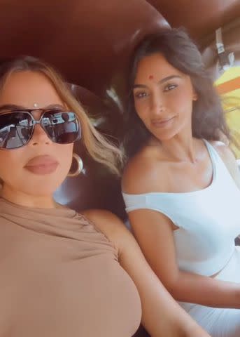 <p>Khloe Kardashian/Instagram</p> Kim and Khloe Kardashian ride a rickshaw in Mumbai, India